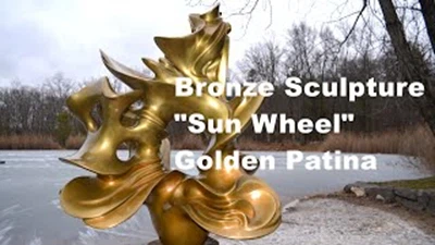 Zlatna patinirana brončana skulptura Sunčani kotač