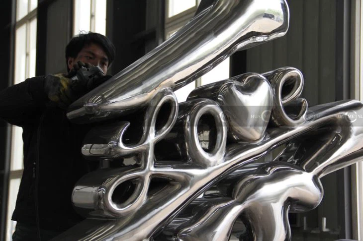 Hand-polished-1 Calligraphy-sculptures-Chromatic-coating-stainless-steel--Calligraphy-sculptures-artwork-foundry